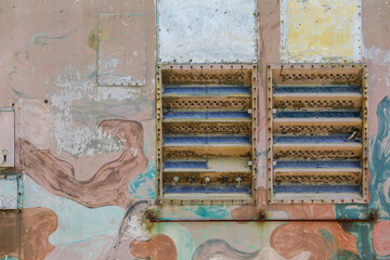Abstract Peeling Paint Wall with Rusted Metal Ventilation Grille