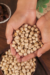 Fresh Dried Chickpeas in Cupped Hands - Healthy Legume Ingredient for Cooking