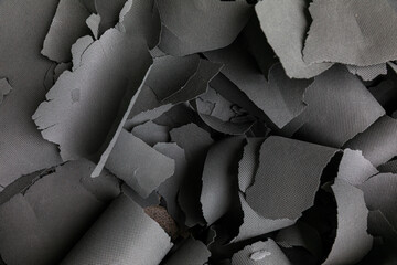 Abstract Background of Gray Cutouts and Curled Material Scraps