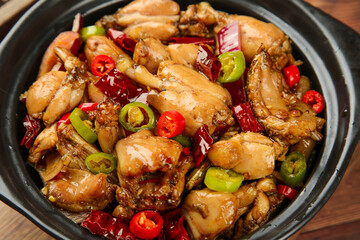 Spicy Stir-Fried Chicken with Red and Green Peppers in Traditional Asian Bowl