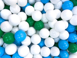 Full Frame of White, Blue, and Green Plastic Ball Pit Balls Texture