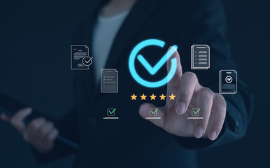 Quality assurance and compliance concept showing business person touching holographic checkmark icon with five stars and document approval graphics,symbolizing quality control, standard certification.