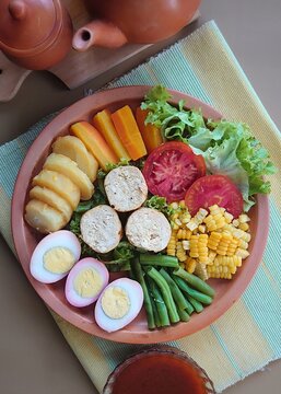 Selat solo galantine with steamed vegetables and brown sauces. This dish can be served warm or cold