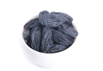 Black Dried Raisins from Turpan Xinjiang in White Bowl on White Background