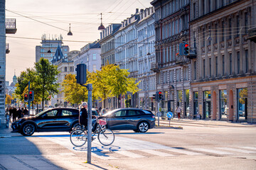 Traffic at Copenhagen intersection with cars and people in the morning, Denmark. Life on streets Scandinavian city.   © Tomasz