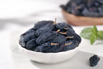 Tricolor Raisins from Turpan Xinjiang China in White Bowl - Premium Dried Grapes Healthy Snack