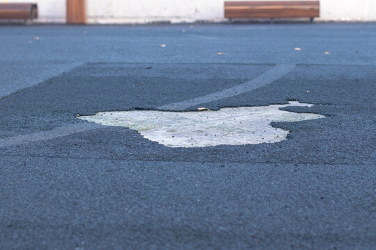 The surface of the football pitch is damaged.