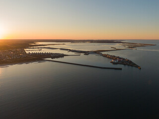 Aerial Sunset View of Olpenitz Harbor - Golden Hour Drone Shot Over Vacation Homes & Marina Baltic Sea Germany