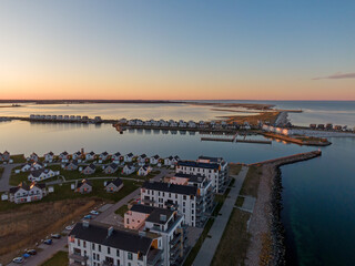 Aerial Sunset View of Olpenitz Harbor - Golden Hour Drone Shot Over Vacation Homes & Marina Baltic Sea Germany