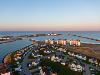 Aerial Sunset View of Olpenitz Harbor - Golden Hour Drone Shot Over Vacation Homes & Marina Baltic Sea Germany