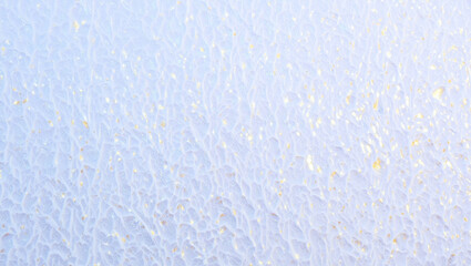 Abstract light blue surface featuring subtle organic textures and scattered gold glitter creating a contemporary and elegant background for design projects and luxury branding
