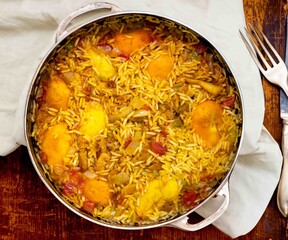Traditional Brazilian dish of rice, chicken, and pequi ,caryocar brasiliense, known as Goiana chicken stew.	