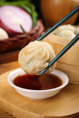 Traditional Chinese Shengjian Pork Buns with Soy Sauce Dipping - Authentic Asian Breakfast Dumplings