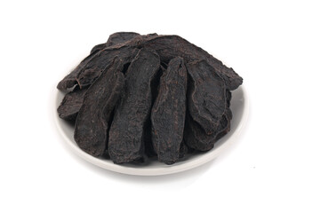 Dried Shou Puerh Chinese Tea Leaves on White Plate for Traditional Herbal Medicine Preparation