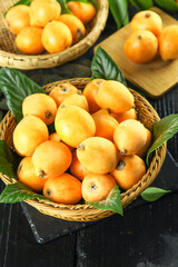 Fresh Loquat Fruits in Wicker Baskets with Leaves - Organic Asian Fruit Harvest Display