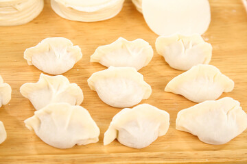 Fresh Handmade Chinese Pork and Mushroom Dumplings on Wooden Board Traditional Asian Cuisine