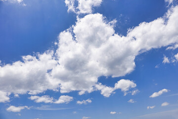 Bright Blue Sky with White Fluffy Clouds Natural Background Wallpaper