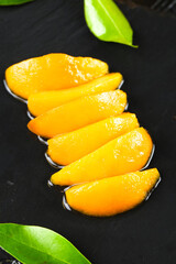 Fresh Sliced Loquat Fruit with Green Leaves on Dark Background - Asian Star Fruit Photography