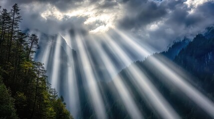 Dramatic sunlight beams piercing through mountain landscape