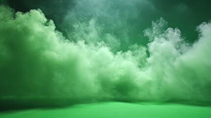 Thick fog or smoke drifts gracefully across a green screen backdrop creating an atmospheric effect in a studio setting