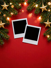 Vibrant red background with green fir border, gold stars, bokeh lights, and two blank photo frames