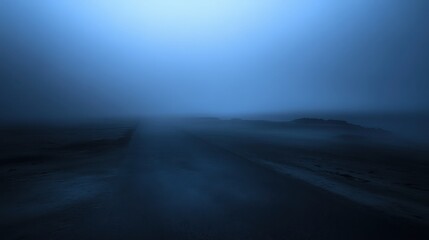 Misty coastal road obscured by dense fog in the early morning