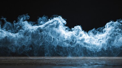 Wispy cloud rolls in a mystical display of smoke at the base, creating an ethereal atmosphere in low light conditions