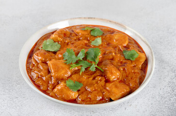 Indian butter chicken in creamy tomato and spice sauce with cilantro. Concept menus, blogs, delivery, cookbooks.
