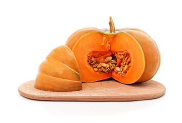 Sliced pumpkin with seeds on wooden board isolated on white background.