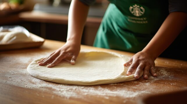 hands expertly stretch fresh pizza dough