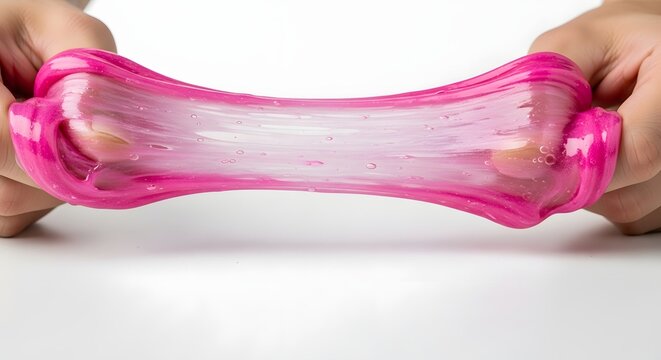 Hands stretching pink slime with glitter