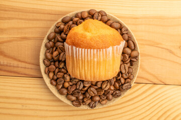 Delicious muffins  on a wooden table, top view, close-up.