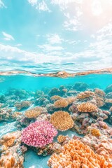 Naklejka premium Vibrant coral reef ecosystem under clear blue sky with fluffy clouds, diverse marine life, ocean depths with colorful underwater formations, natural ocean beauty.