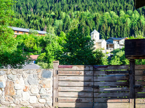 cityscape of Mestia town with church in summer
