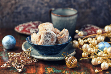 Traditional christmas cookies in a bowl on a wooden background. Soft focus.