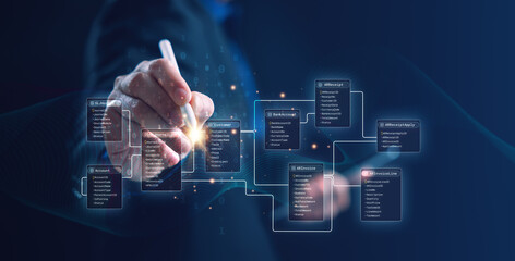 A developer using a digital interface to design an SQL database schema and entity relationship diagram (ERD) with connected tables. Perfect for data engineering, system design, and IT concepts.