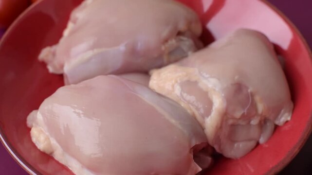 Chicken thigh fillet, skinless and boneless meat for grilling or barbecue. Chicken thigh fillet