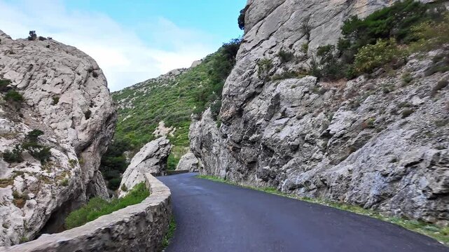 Driving through the amazing Gorges de Galamus, Aude, Eastern Pyrenees, Languedoc Roussillon in France.