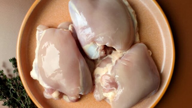 Chicken thigh fillet, skinless and boneless meat for grilling or barbecue. Chicken thigh fillet