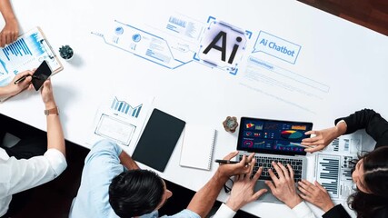 A modern business meeting showcasing a diverse team discussing strategy while utilizing AI chatbot technology for data-driven analysis and innovative solutions. Raster - Powered by Adobe