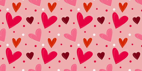 Seamless vector pattern with red, pink, and coral hearts on pastel background. Simple flat design for Valentine’s Day theme in minimal geometric style