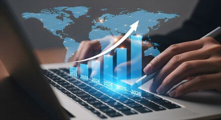 Business Growth Concept with Graph and World Map Showing Financial Success and Global Expansion Projected from 2023 to 2026 Analyzing Data on Laptop for Strategic Planning