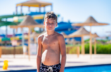 A boy near a pool at a hotel in Egypt