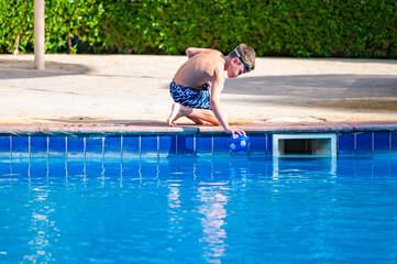 A boy near a pool at a hotel in Egypt