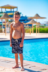 A boy near a pool at a hotel in Egypt