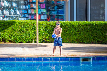 A boy near a pool at a hotel in Egypt