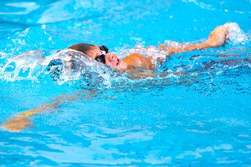 happy boy swimming in the pool