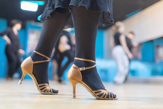 Dancers practice graceful movements in a vibrant dance class setting