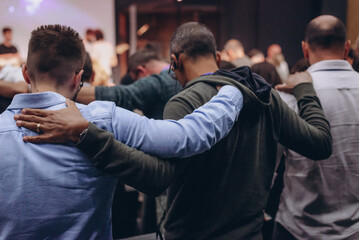 A Group of Christians pray to bless and pray for each other in church