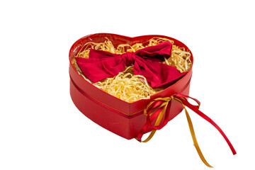 Red heart-shaped gift box with ribbon and straw filling on white background, Valentine’s gift, decorative packaging